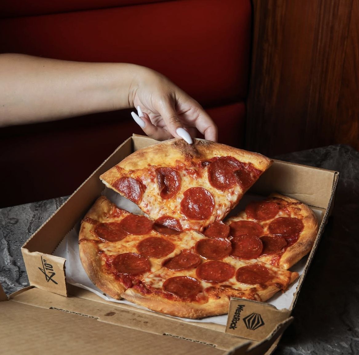 Fresh cheese pull on a pepperoni pizza slice at Pronto Amore Pizza